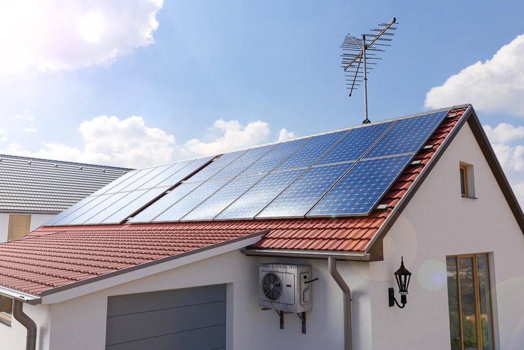 House with solar panels and an antenna.