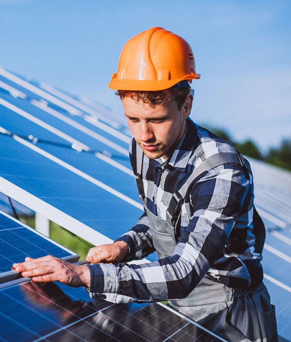 Worker installing solar panels.